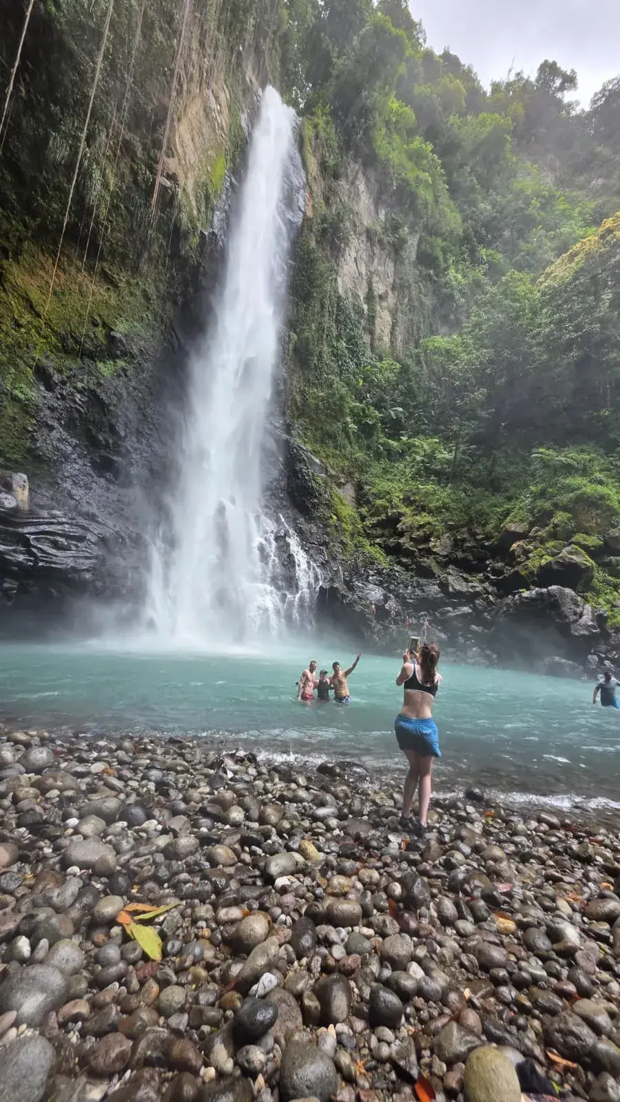 Victoria Falls tumbling into a turquoise pool in Dominica